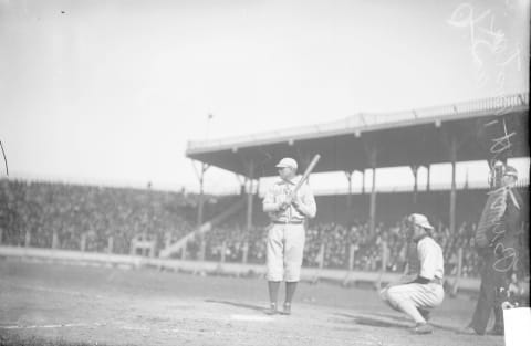 UNITED STATES – CIRCA 1905: Full-length portrait of Jesse Burkett, outfielder for the American League Boston Red Sox, batting, waiting for a pitch, Chicago, 1905. The catcher and umpire are in position at home plate at South Side Park in the Armour Square community area of Chicago, Illinois. Spectators in the bleachers are visible in the background. From the Chicago Daily News collection. (Photo by Chicago History Museum/Getty Images)