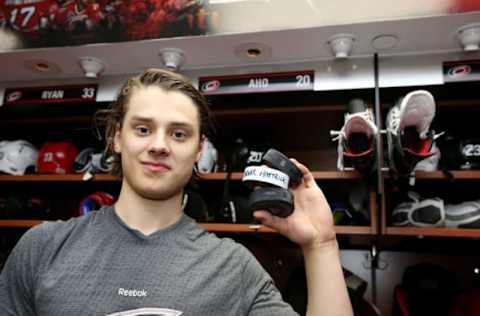 RALEIGH, NC – JANUARY Sebastian Aho #20 of the Carolina Hurricanes poses with 3 pucks as he celebrates his first NHL hat trick during an NHL game against the Philadelphia Flyers on January 31, 2017 at PNC Arena in Raleigh, North Carolina. (Photo by Gregg Forwerck/NHLI via Getty Images)