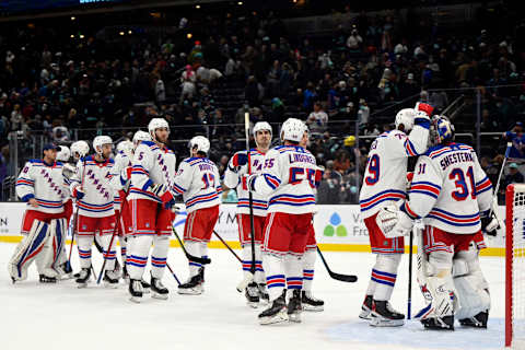 Oct 31, 2021; Seattle, Washington, USA; The New York Rangers celebrate after defeating the Seattle Kraken at Climate Pledge Arena. New York defeated Seattle 3-1. Mandatory Credit: Steven Bisig-USA TODAY Sports