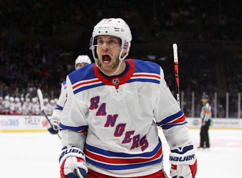 NEW YORK, NEW YORK – FEBRUARY Tony DeAngelo #77 of the New York Rangers celebrates a first period goal by Artemi Panarin #10 against the New York Islanders at NYCB Live’s Nassau Coliseum on February 25, 2020 in Uniondale, New York. (Photo by Bruce Bennett/Getty Images)