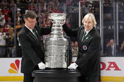 LAS VEGAS, NV – JUNE 07: Craig Campbell, left, and Phil Pritchard, The Keepers of the Stanley Cup, bring the Stanley Cup onto the ice after Game Five of the 2018 NHL Stanley Cup Final between the Washington Capitals and the Vegas Golden Knights at T-Mobile Arena on June 7, 2018 in Las Vegas, Nevada. The Capitals defeated the Golden Knights 4-3. (Photo by Bruce Bennett/Getty Images)