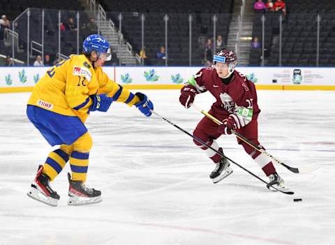 EDMONTON, AB – AUGUST 17: Dans Locmelis #11 of Latvia skates during the game against Sweden in the IIHF World Junior Championship on August 17, 2022 at Rogers Place in Edmonton, Alberta, Canada (Photo by Andy Devlin/ Getty Images)