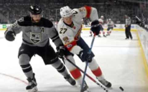 Feb 18, 2017; Los Angeles, CA, USA; Los Angeles Kings defenseman Drew Doughty (8) and Florida Panthers center Nick Bjugstad (27) battle for the puck in the first period of the game at Staples Center. Mandatory Credit: Jayne Kamin-Oncea-USA TODAY Sports