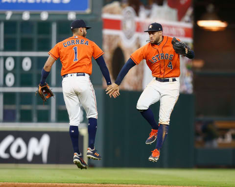 HOUSTON, TX – JUNE 01: Carlos Correa #1 of the Houston Astros and George Springer #4 celebrate after the final out against the Boston Red Sox at Minute Maid Park on June 1, 201,8 in Houston, Texas. (Photo by Bob Levey/Getty Images)