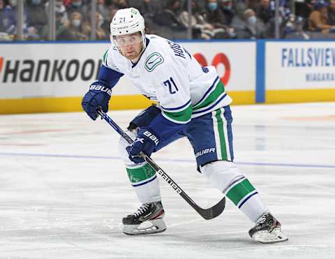 TORONTO, ON – MARCH 5: Nils Hoglander #21 of the Vancouver Canucks skates against the Toronto Maple Leafs during an NHL game at Scotiabank Arena on March 5, 2022 in Toronto, Ontario, Canada. The Canucks defeated the Maple Leafs 6-4. (Photo by Claus Andersen/Getty Images)