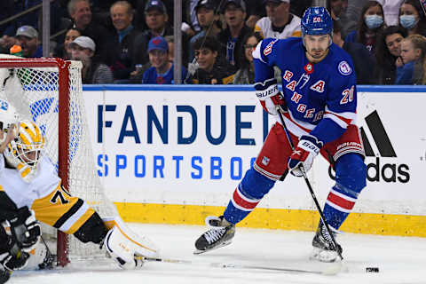 May 5, 2022; New York, New York, USA; New York Rangers left wing Chris Kreider (20) skates the puck out from behind the net against the Pittsburgh Penguins during the first period in game two of the first round of the 2022 Stanley Cup Playoffs at Madison Square Garden. Mandatory Credit: Dennis Schneidler-USA TODAY Sports