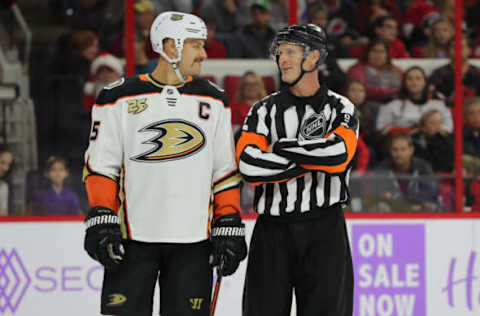 RALEIGH, NC – NOVEMBER 30: Anaheim Ducks center Ryan Getzlaf (15) and a ref smile at each other during the 1st period of the Carolina Hurricanes game versus the Anaheim Ducks on November 30th, 2018 at PNC Arena in Raleigh, NC. (Photo by Jaylynn Nash/Icon Sportswire via Getty Images)