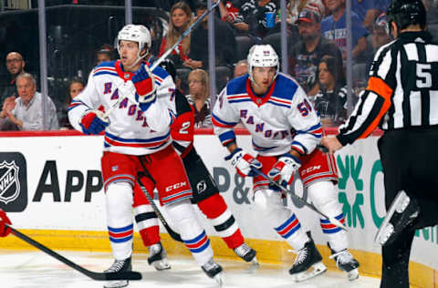 NEWARK, NEW JERSEY – OCTOBER 04: (L-R) Brennan Othmann #78 and Will Cuylle #50 of New York Rangers skate against the New Jersey Devils during the first period at Prudential Center on October 04, 2023 in Newark, New Jersey. (Photo by Bruce Bennett/Getty Images)