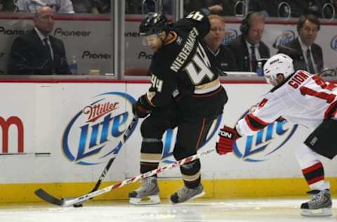 ANAHEIM, CA: Rob Niedermayer #44 of the Anaheim Ducks handles the puck against Brian Gionta #14 of the New Jersey Devils on January 11, 2009. (Photo by Bruce Bennett/Getty Images)