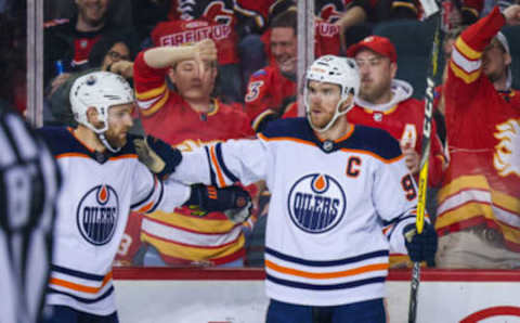 May 20, 2022; Calgary, Alberta, CAN; Edmonton Oilers center Connor McDavid (97) celebrates his goal with Edmonton Oilers center Leon Draisaitl (29) during the second period against the Calgary Flames in game two of the second round of the 2022 Stanley Cup Playoffs at Scotiabank Saddledome. Mandatory Credit: Sergei Belski-USA TODAY Sports