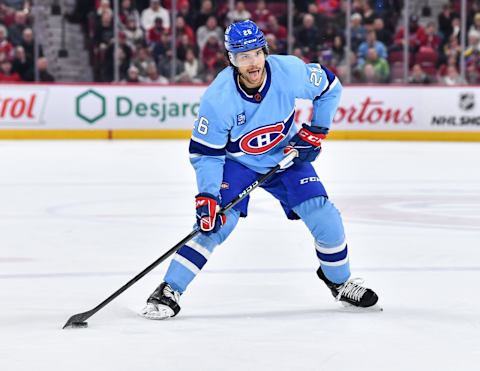 MONTREAL, CANADA – FEBRUARY 11: Johnathan Kovacevic #26 of the Montreal Canadiens skates the puck during the second period against the New York Islanders at Centre Bell on February 11, 2023 in Montreal, Quebec, Canada. The Montreal Canadiens defeated the New York Islanders 4-3 in overtime. (Photo by Minas Panagiotakis/Getty Images)