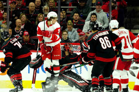 RALEIGH, NC – NOVEMBER 1: Tyler Bertuzzi #59 of the Detroit Red Wings jumps in the crease to avoid the puck as Petr Mrazek #34 of the Carolina Hurricanes protects the net during an NHL game on November 1, 2019 at PNC Arena in Raleigh, North Carolina. (Photo by Gregg Forwerck/NHLI via Getty Images)