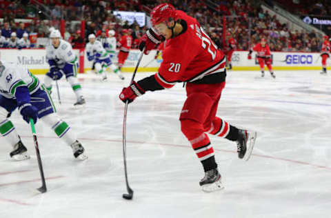 RALEIGH, NC – FEBRUARY 02: Carolina Hurricanes center Sebastian Aho (20) shoots the puck during the 1st period of the Carolina Hurricanes game versus the Vancouver Canucks on February 2nd, 2020 at PNC Arena in Raleigh, NC. (Photo by Jaylynn Nash/Icon Sportswire via Getty Images)