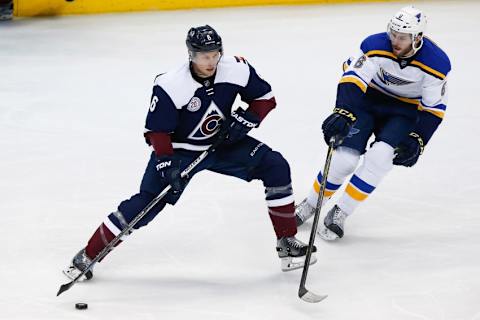 Apr 3, 2016; Denver, CO, USA; Colorado Avalanche defenseman Erik Johnson (6) controls the puck against St. Louis Blues defenseman Joel Edmundson (6) in the second period at the Pepsi Center. Mandatory Credit: Isaiah J. Downing-USA TODAY Sports