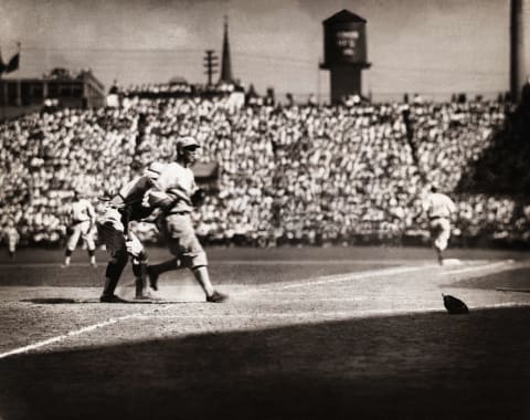 Bill Rariden of the Cincinnati Reds tags Buck Weaver of the Chicago White Sox out at home plate in the second game of the 1919 World Series at Crosley Field. The Red defeated the White Sox, 4-2, taking a 2-0 lead in the series.