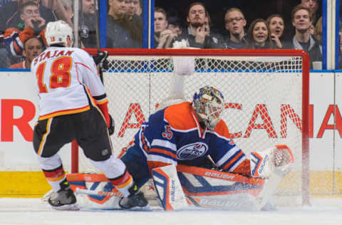 EDMONTON, AB – MARCH 22: Matt Stajan scores on a penalty shot against Viktor Fasth. (Photo by Derek Leung/Getty Images)