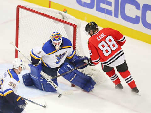 Apr 7, 2016; Chicago, IL, USA; St. Louis Blues goalie Brian Elliott (1) makes a save on a shot from Chicago Blackhawks right wing Patrick Kane (88) during the overtime period at the United Center. St. Louis won 2-1 in overtime. Mandatory Credit: Dennis Wierzbicki-USA TODAY Sports