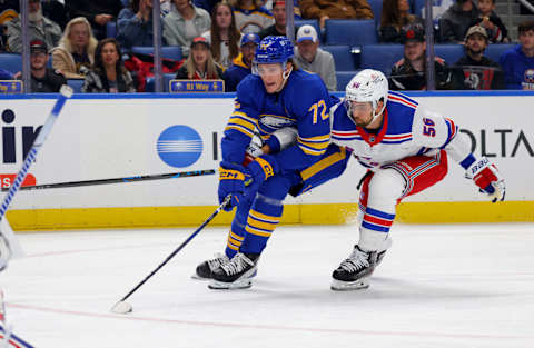 Oct 12, 2023; Buffalo, New York, USA; Buffalo Sabres right wing Tage Thompson (72) skates with the puck as New York Rangers defenseman Erik Gustafsson (56) defends during the first period at KeyBank Center. Mandatory Credit: Timothy T. Ludwig-USA TODAY Sports