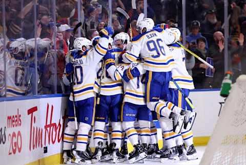 Apr 29, 2022; Buffalo, New York, USA; The Buffalo Sabres celebrate an overtime win against the Chicago Blackhawks at KeyBank Center. Mandatory Credit: Timothy T. Ludwig-USA TODAY Sports