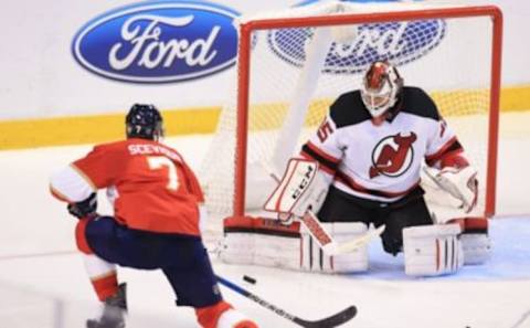 Oct 13, 2016; Sunrise, FL, USA; New Jersey Devils goalie Cory Schneider (35) makes a save on a shot by Florida Panthers center Colton Sceviour (7) in the third period at BB&T Center. Mandatory Credit: Robert Mayer-USA TODAY Sports