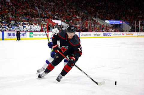 RALEIGH, NORTH CAROLINA – JUNE 08: Andrei Svechnikov #37 of the Carolina Hurricanes skates with the puck during the third period in Game Five of the Second Round of the 2021 Stanley Cup Playoffs against the Tampa Bay Lightning at PNC Arena on June 08, 2021, in Raleigh, North Carolina. (Photo by Jared C. Tilton/Getty Images)