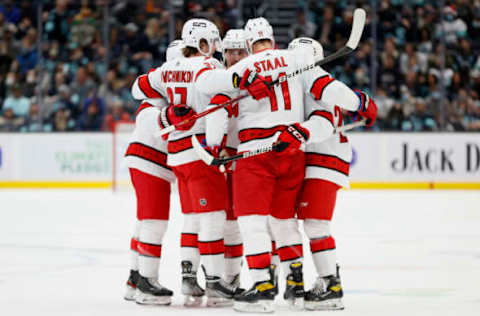 SEATTLE, WASHINGTON – NOVEMBER 24: Brendan Smith #7 of the Carolina Hurricanes celebrates his goal against the Seattle Kraken during the first period at Climate Pledge Arena on November 24, 2021, in Seattle, Washington. (Photo by Steph Chambers/Getty Images)