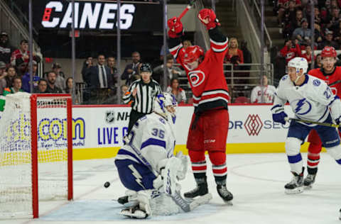 RALEIGH, NC – OCTOBER 06: Carolina Hurricanes Center Erik Haula (56) reacts after the game-tying goal by Carolina Hurricanes Defenceman Dougie Hamilton (19) gets past Tampa Bay Lightning Goalie Curtis McElhinney (35) during a game between the Tampa Bay Lightning and the Carolina Hurricanes at the PNC Arena in Raleigh, NC on October 6, 2019.(Photo by Greg Thompson/Icon Sportswire via Getty Images)