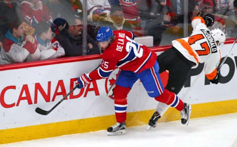 Feb 19, 2016; Montreal, Quebec, CAN; Philadelphia Flyers defenseman Andrew MacDonald (47) is checked by Montreal Canadiens left wing Jacob De La Rose (25) during the first period at Bell Centre. Mandatory Credit: Jean-Yves Ahern-USA TODAY Sports