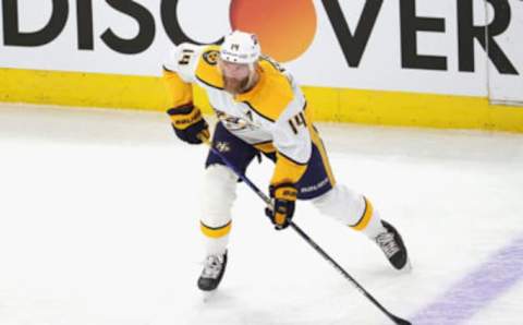 CHICAGO, ILLINOIS – MARCH 28: Mattias Ekholm #14 of the Nashville Predators looks to pass against the Chicago Blackhawks at the United Center on March 28, 2021 in Chicago, Illinois. (Photo by Jonathan Daniel/Getty Images)