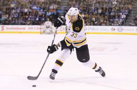 Mar 26, 2016; Toronto, Ontario, CAN; Boston Bruins defenseman Zdeno Chara (33) shoots against the Toronto Maple Leafs at Air Canada Centre. The Bruins beat the Maple Leafs 3-1. Mandatory Credit: Tom Szczerbowski-USA TODAY Sports