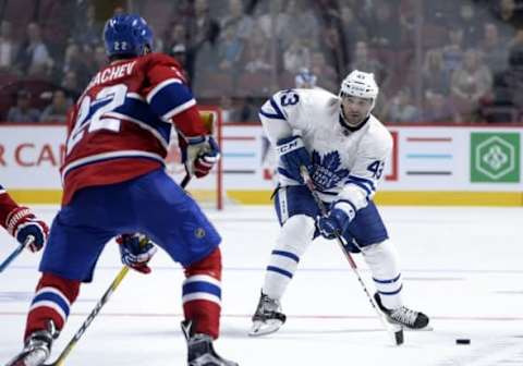 Oct 6, 2016; Montreal, Quebec, CAN; Toronto Maple Leafs forward Auston Matthews (34) plays the puck and Montreal Canadiens defenseman Mikhail Sergachev (22) defends during the third period of a preseason hockey game at the Bell Centre. Mandatory Credit: Eric Bolte-USA TODAY Sports