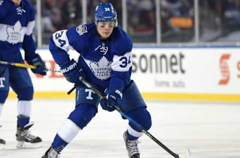 Jan 1, 2017; Toronto, Ontario, CAN; Toronto Maple Leafs Auston Matthews (34) skates the puck up ice against Detroit Red Wings during the Centennial Classic ice hockey game at BMO Field. Mandatory Credit: Dan Hamilton-USA TODAY Sports