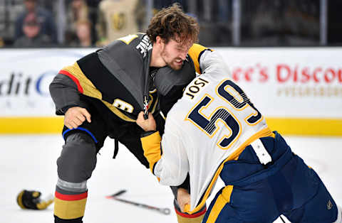 LAS VEGAS, NEVADA – OCTOBER 15: Mark Stone #61 of the Vegas Golden Knights fights Roman Josi #59 of the Nashville Predators during the first period at T-Mobile Arena on October 15, 2019 in Las Vegas, Nevada. (Photo by Jeff Bottari/NHLI via Getty Images)