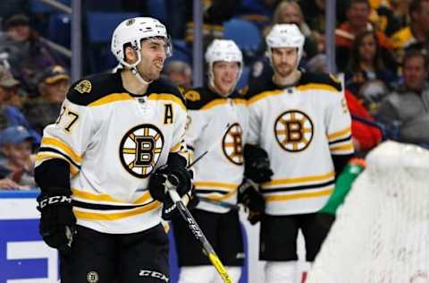 NHL Power Rankings: Boston Bruins center Patrice Bergeron (37) celebrates after scoring the winning goal against the Buffalo Sabres during the third period at KeyBank Center. The Bruins beat the Sabres 2-1. Mandatory Credit: Kevin Hoffman-USA TODAY Sports