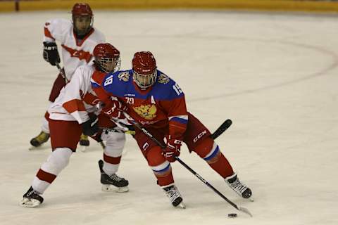 ERZURUM, TURKEY – FEBRUARY 13 : Vasily Podkolzin (R) of Russia in action during Boys’ Preliminary Round – Group A Ice Hockey Game between Turkey and Russia within the European Youth Olympics Winter Festival 2017 at Ice Hockey Arena in Erzurum, Turkey on February 13, 2017. (Photo by Gokhan Balci/Anadolu Agency/Getty Images)