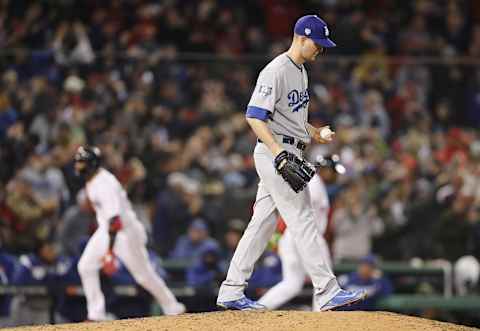 BOSTON, MA – OCTOBER 23: Alex Woood #57 of the Los Angeles Dodgers reacts as Eduardo Nunnez #36 of the Boston Red Sox rounds the bases after his three-run home run during the seventh inning in Game One of the 2018 World Series at Fenway Park on October 23, 2018 in Boston, Massachusetts. (Photo by Maddie Meyer/Getty Images)