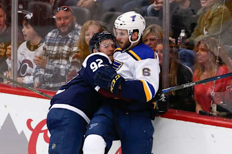 Apr 3, 2016; Denver, CO, USA; Colorado Avalanche left wing Gabriel Landeskog (92) and St. Louis Blues defenseman Joel Edmundson (6) get caught up in the first period at the Pepsi Center. Mandatory Credit: Isaiah J. Downing-USA TODAY Sports