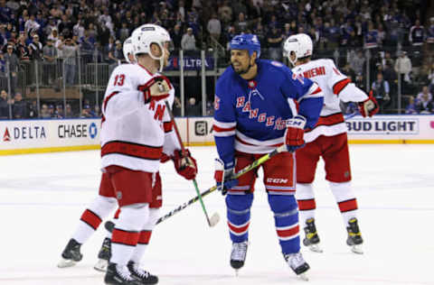 NEW YORK, NEW YORK – MAY 24: Ryan Reaves #75 of the New York Rangers confronts Max Domi #13 of the Carolina Hurricanes near the end of their game in Game Four of the Second Round of the 2022 Stanley Cup Playoffs at Madison Square Garden on May 24, 2022, in New York City. The Rangers defeated the Hurricanes 4-1. (Photo by Bruce Bennett/Getty Images)