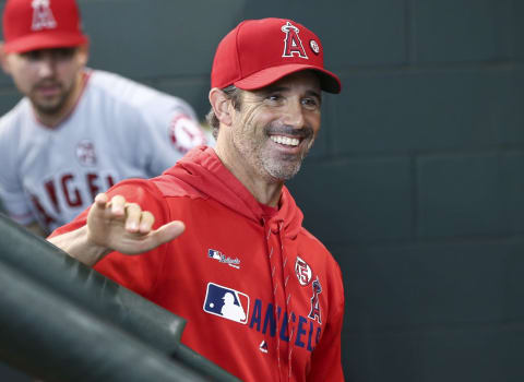 Sep 22, 2019; Houston, TX, USA; Los Angeles Angels manager Brad Ausmus (12) smiles in the dugout before a game against the Houston Astros at Minute Maid Park. Mandatory Credit: Troy Taormina-USA TODAY Sports