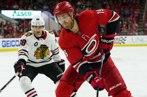 RALEIGH, NC – NOVEMBER 12: Chicago Blackhawks Center Jonathan Toews (19) looks to dump the puck back in the zone in front of Chicago Blackhawks Right Wing Patrick Kane (88) during a game between the Chicago Blackhawks and the Carolina Hurricanes at the PNC Arena in Raleigh, NC on November 12, 2018. (Photo by Greg Thompson/Icon Sportswire via Getty Images)