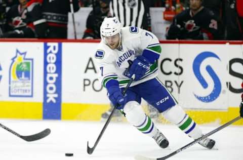 Jan 15, 2016; Raleigh, NC, USA; Vancouver Canucks forward Linden Vey (7) skates with the puck against the Carolina Hurricanes at PNC Arena. The Vancouver Canucks defeated the Carolina Hurricanes 3-2 in overtime. Mandatory Credit: James Guillory-USA TODAY Sports