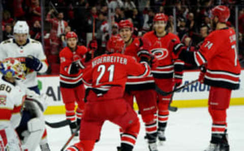 RALEIGH, NC – DECEMBER 21: Nino Niederreiter #21 of the Carolina Hurricanes scores a goal and celebrates with teammate Teuvo Teravainen #86 during an NHL game against the Florida Panthers on December 21, 2019 at PNC Arena in Raleigh, North Carolina. (Photo by Gregg Forwerck/NHLI via Getty Images)