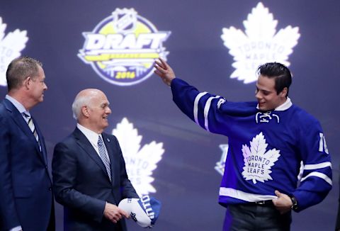 BUFFALO, NY – JUNE 24: Auston Matthews celebrates onstage with Toronto Maple Leafs General Manager Lou Lamoriello  (Photo by Bruce Bennett/Getty Images)