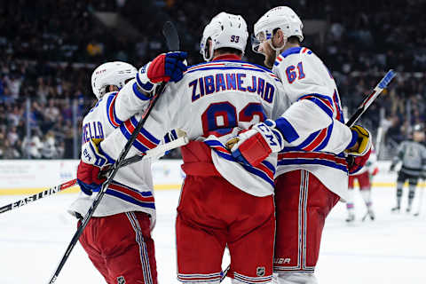 Mar 25, 2017; Los Angeles, CA, USA; New York Rangers right wing Rick Nash (61) celebrates with center Mika Zibanejad (93) and right wing Mats Zuccarello (36) after an open net goal against the Los Angeles Kings during the third period at Staples Center. The Rangers won 3-0. Mandatory Credit: Kelvin Kuo-USA TODAY Sports.