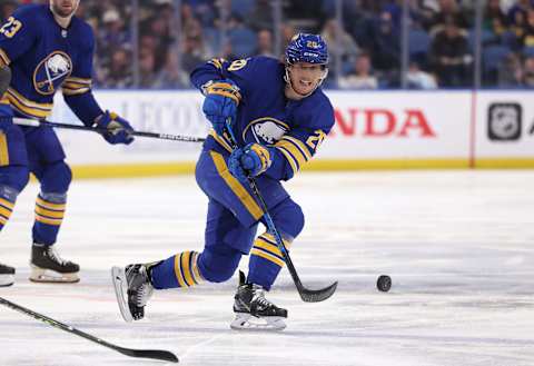 Mar 10, 2022; Buffalo, New York, USA; Buffalo Sabres center Cody Eakin (20) shoots the puck up ice during the second period against the Vegas Golden Knights at KeyBank Center. Mandatory Credit: Timothy T. Ludwig-USA TODAY Sports