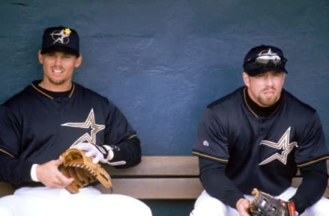 HOUSTON – 1999: Craig Biggio (L) and Jeff Bagwell of the Houston Astros sit in the dugout during a 1999 season MLB game at the Astrodome in Houston, Texas. (Photo by Steve Babineau/MLB Photos via Getty Images)