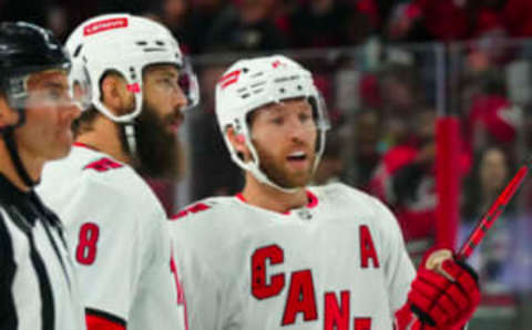 Sep 27, 2023; Raleigh, North Carolina, USA; Carolina Hurricanes defenseman Brent Burns (8) and Carolina Hurricanes defenseman Jaccob Slavin (74) talk against the Florida Panthers during the second period at PNC Arena. Mandatory Credit: James Guillory-USA TODAY Sports