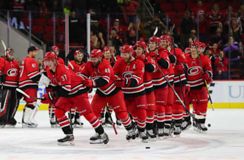 RALEIGH, NC – DECEMBER 05: Carolina Hurricanes celebrate a win at the end of the OT period of the Carolina Hurricanes game versus the New York Rangers on December 5th, 2019 at PNC Arena in Raleigh, NC (Photo by Jaylynn Nash/Icon Sportswire via Getty Images)