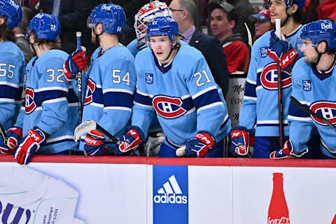 MONTREAL, CANADA – DECEMBER 10: Kaiden Guhle #21 of the Montreal Canadiens stands up at the bench during the third period against the Los Angeles Kings at Centre Bell on December 10, 2022 in Montreal, Quebec, Canada. The Los Angeles Kings defeated the Montreal Canadiens 4-2. (Photo by Minas Panagiotakis/Getty Images)