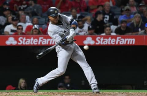 Jun 12, 2017; Anaheim, CA, USA; New York Yankees second baseman Starlin Castro (14) hits a single against the Los Angeles Angels in the fifth inning at Angel Stadium of Anaheim. Mandatory Credit: Richard Mackson-USA TODAY Sports